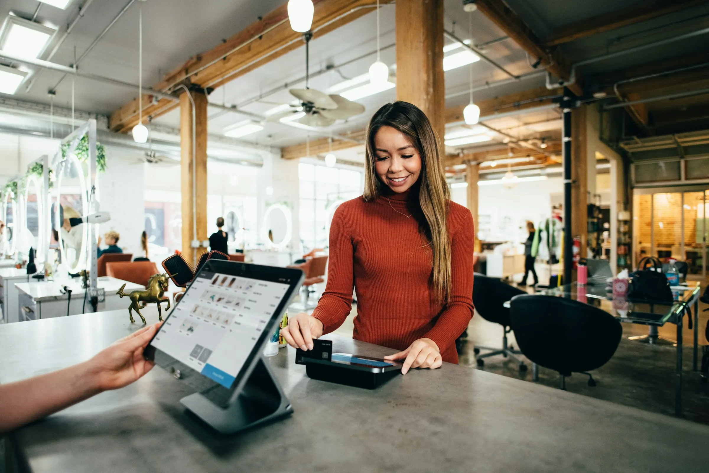 A smiling receptionist at her desk